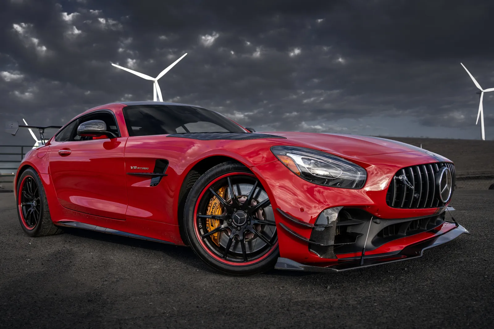 Mercedes-AMG GT R front three-quarter with wind turbines behind