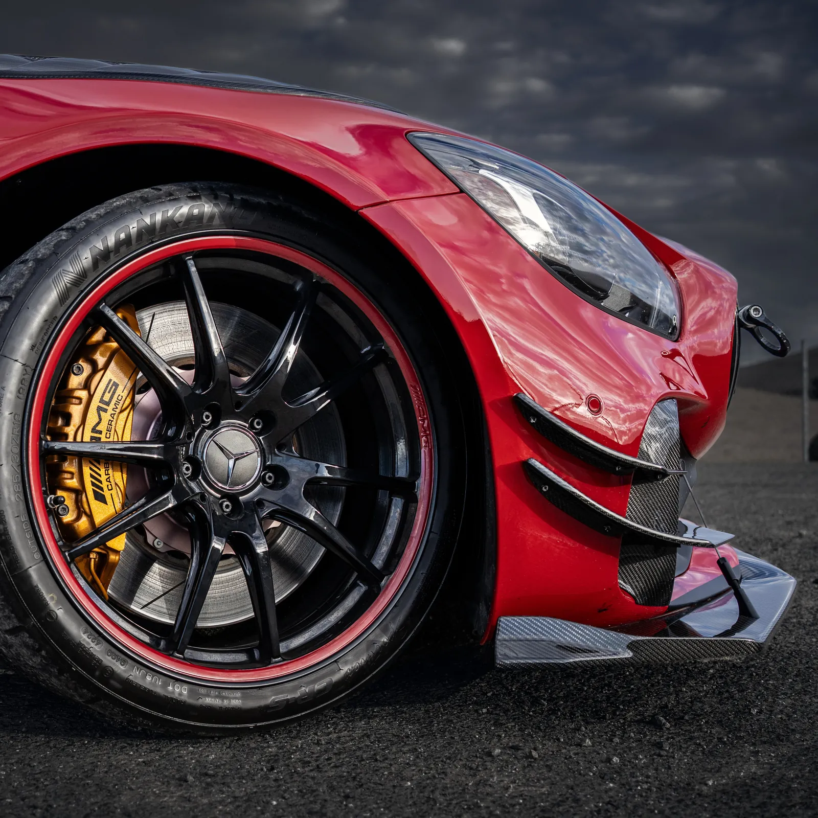 Mercedes-AMG GT R front wheel, yellow brake caliper and carbon dive planes